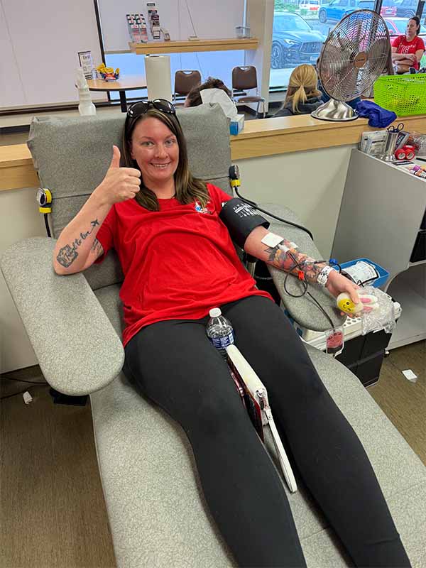 Group of people in red shirts