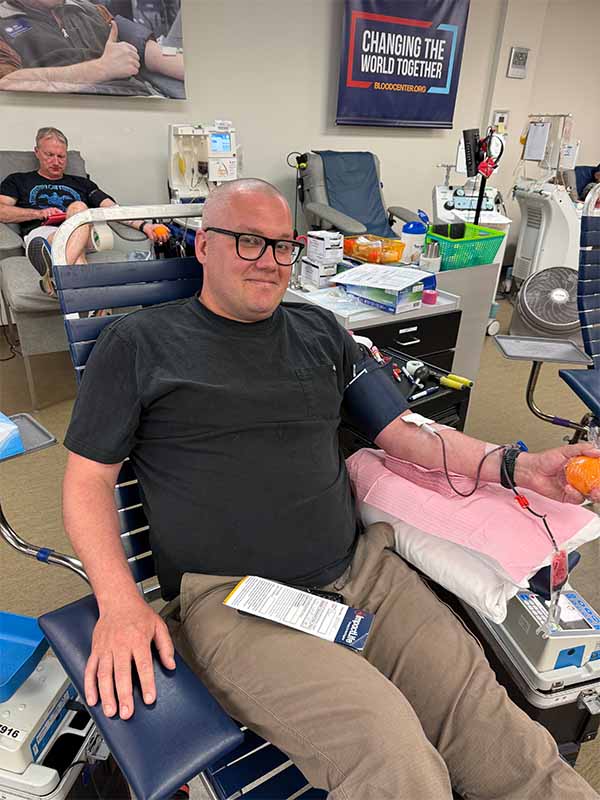 Male donor giving blood