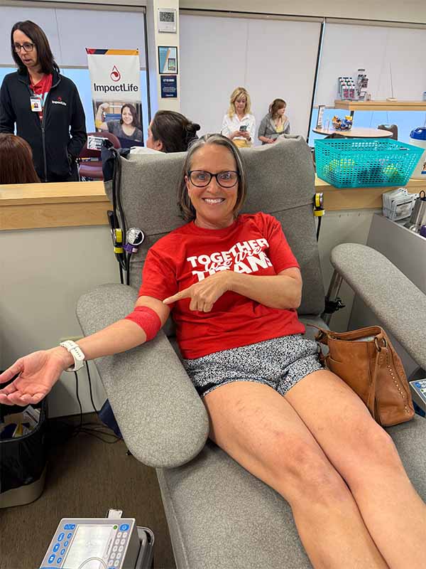 Female donor smiling while donating blood