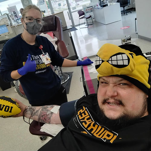 Example of a blood donor taking a photo while donating