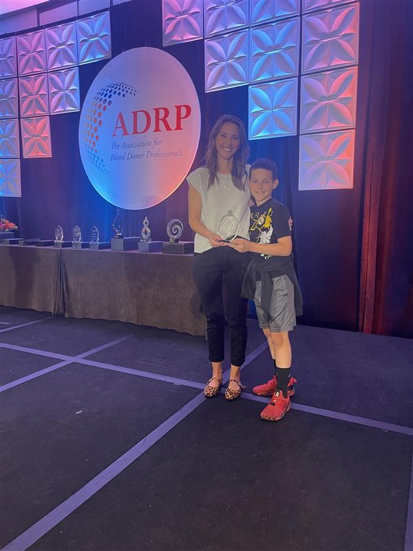 Jessica & Hudson McKearney receiving award