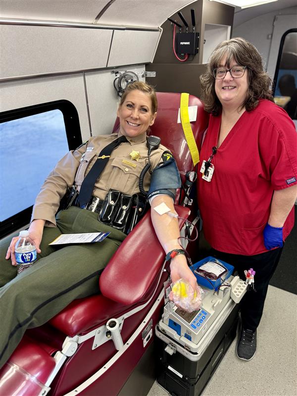 Trooper Tracy donating blood