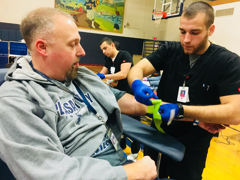 Will Kohn's father, Chris Kohn, donating in 2018