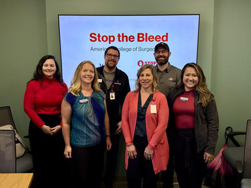 Back row, left to right: Libby Bair, Account Manager, Chad Sabin, Community Development Advocate, and Matthew Roberts, Medics First Training and Clinical Quality Coordinator  Front row, left to right: Michelle Trunnell, Donor Relations Manager, Cassandra Schoonover, Senior Account Manager, and Teresa Tran, Account Manager