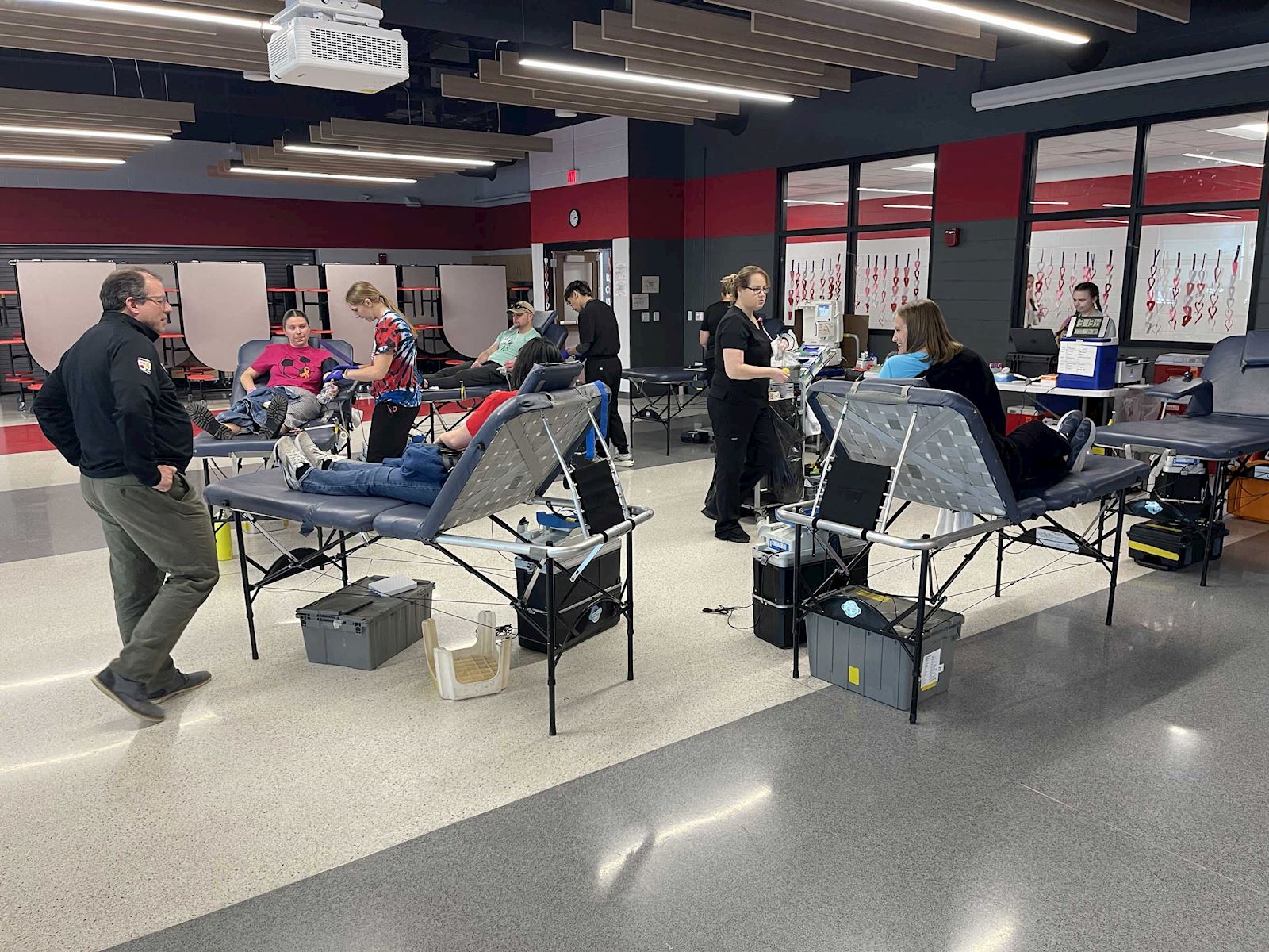 Wide shot of donors and staff participating in the ImpactLife blood drive event.