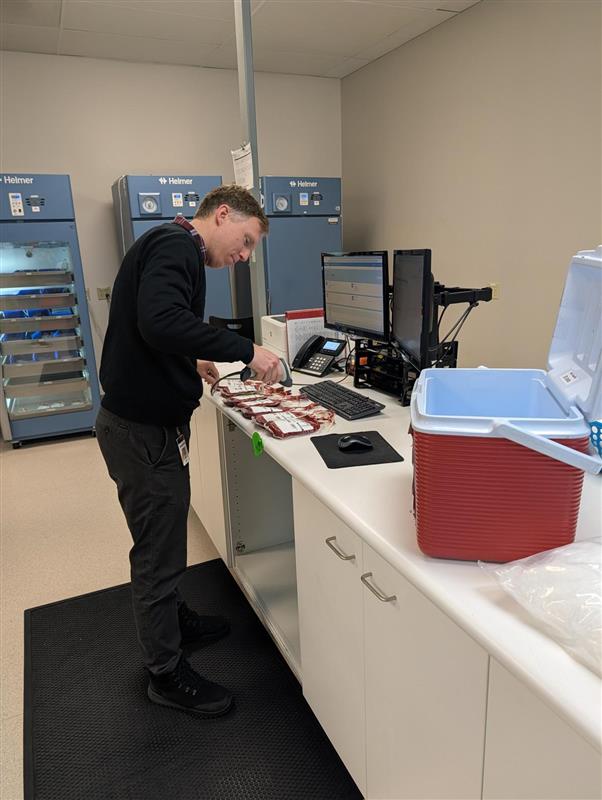 Madison IMD team packs shipment for hospital